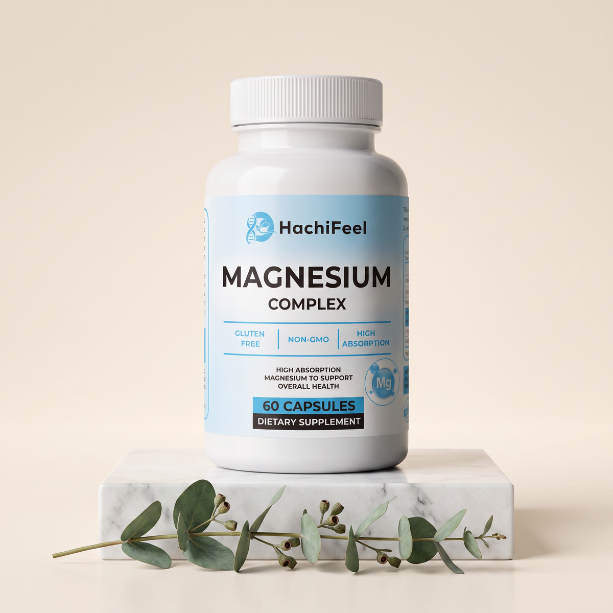 Magnesium Complex bottle on a white marble pedestal with eucalyptus sprig