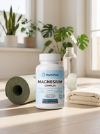Magnesium Complex beside a rolled yoga mat, towel, and water bottle