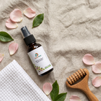 HachiFeel essential oil spray flat lay with massage roller and petals